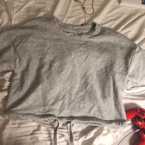 Grey cropped sweatshirt adjustable tie on bottom
